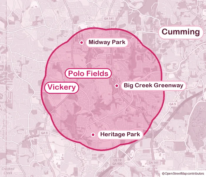 Map of the Cumming, Georgia area with a pink cloud-shaped zone showing where Tails & Mail visits, southwest of Cumming. It covers the Polo Fields and Vickery neighborhoods, plus Midway Park, Heritage Park, and the Big Creek Greenway.